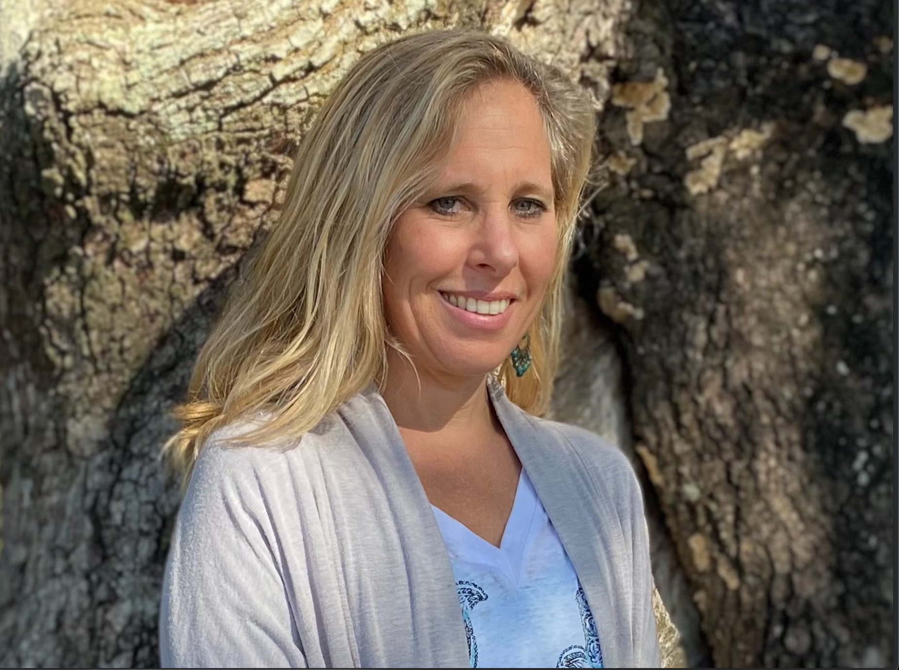 Portrait of Erin Pickus, Lowcountry Movement, against a Charleston live oak